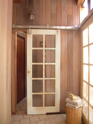 Made to handle heavy barn doors, this hardware will take on any vintage door. All the hardware is exposed and easy to install once you understand the basic components and configuration.